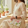 0f3b24dd-720e-44aa-adff-c4a61cac1633 Ivory Bloom Handcrafted Floral Beaded Clutch